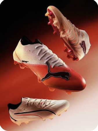 Puma football boots on a red backdrop